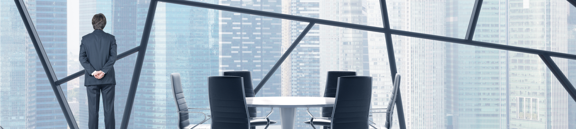 man looking out of accounting office window