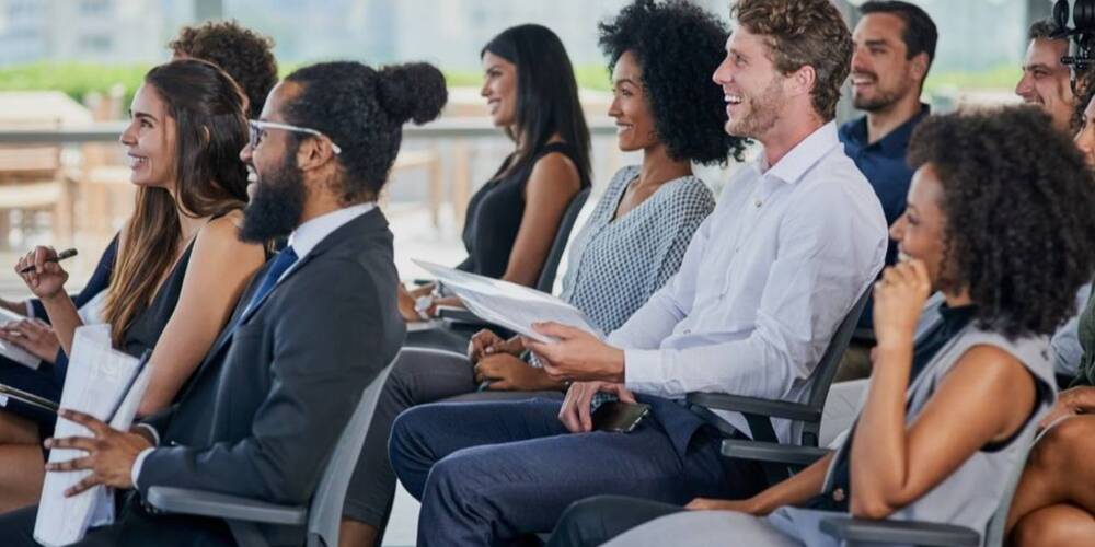 Employees sitting and  learning