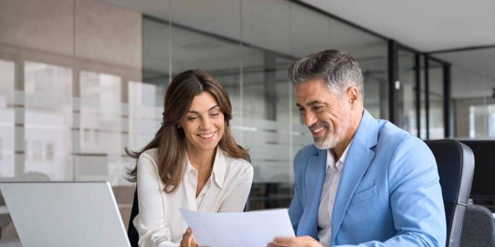 man and woman reviewing resume