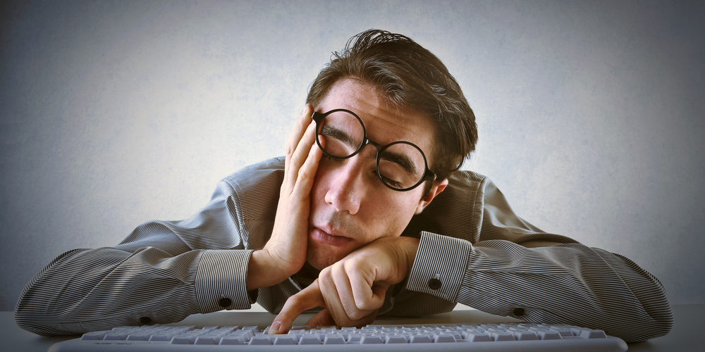 Man collapsing on desk