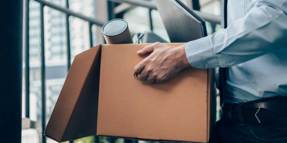 man leaving office with briefcase